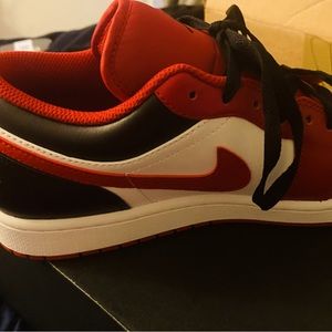 Red and black low top Jordan’s retro 1 size 11